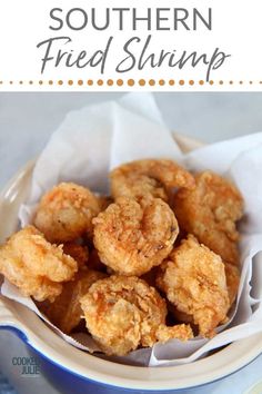 fried shrimp in a white bowl with text overlay that reads southern fried shrimp recipe