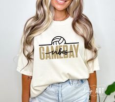 a woman wearing a white shirt with the word gameday printed on it