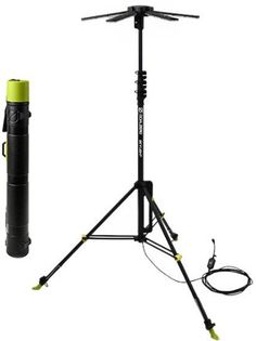 a tripod with a light on it next to a speaker