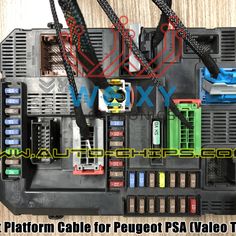 the inside of a car's electrical panel with wires attached to it