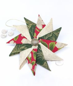 an ornament made out of fabric and paper