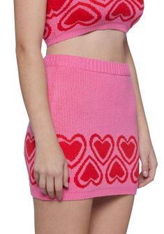 cuz hugs and kisses! This mini skirt has a knit construction, a heart print hem, and an elastic waistband. Pink Heart Print Bottoms For Spring, Trendy Mini Pink Bottoms, Pink Y2k Mini Skirt, Trendy Pink Mini Bottoms, Casual Pink Mini Skort, Trendy Pink Heart Print Bottoms, Trendy Pink Bottoms With Heart Print, Pink Fitted Cute Skort, Fitted Pink Bottoms With Heart Print