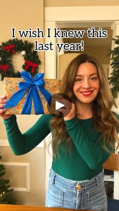 a woman holding up a present with the words i wish i knew this last year