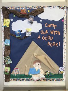 a bulletin board with an image of a camp out with a good book on it