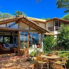 an outdoor patio with table and chairs