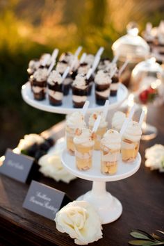 cupcakes and desserts are displayed on a table