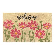 a welcome mat with pink flowers on it