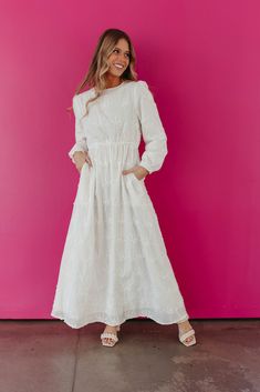 Stay sweet and cute in THE WINNEE MAXI EYELET DRESS. With a charming eyelet design and convenient pockets, this long sleeve dress is perfect for any occasion. Embrace the pure white color and effortlessly stand out in style. Long Sleeve Eyelet Temple Friendly Maxi length Pockets Self: 100% rayon, Lining: 100% polyester Dress is true to size. Small (0-2), Medium (4-6), Large (8-10), X-Large (10-12). Length (shoulder to hem): Small: 55.5", Medium: 56", Large: 56.5", X-Large: 57". Model is 5'5" wea White Temple Dress, Lds Temple Dress, White Temple, Temple Dress, The Pure, Eyelet Dress, Polyester Dress, Dress Ideas, Pure White