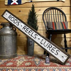 a sign that reads rods reis lurs next to a chair and potted tree