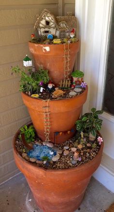 three tiered planters with plants in them