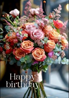 a vase filled with lots of flowers on top of a window sill next to a sign that says happy birthday