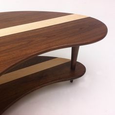 a wooden table with two curved sections on it