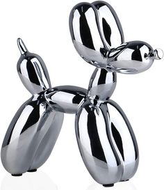 a silver balloon dog sculpture sitting on top of a white floor