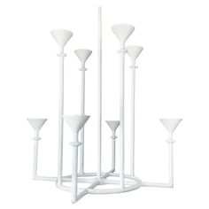 a group of white candlesticks sitting on top of each other next to each other