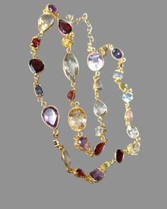 A sublime collection of gemstones forms this gorgeous piece. All set in 14k gold vermeil, on top of 925 silver. NO BRASS There are a total of 34 stones in Amethysts, Citrines, Garnets, Blue Topaz, Tanzanites. All in varying sizes and varying cuts. The largest measures 15mm x 8mm, smallest 5mm. Length of necklace is 18 inches with a further 3/4" of extension chain. Fine Jewelry Multi-stone Briolette Gemstones, Amethyst Multi-stone Briolette Gemstones, Amethyst Briolette Multi-stone Gemstones, Elegant Multicolor Amethyst Necklaces, Paste Jewelry, Fine Necklace, Multi Gemstone Necklace, Chain Styles, Gemstone Necklace