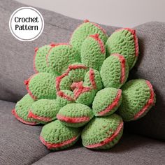 a pile of green crocheted flowers sitting on top of a gray couch with the word crochet pattern over it