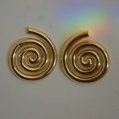 Introducing our ZANI EARRINGS - CLASSIC, a fusion of vintage and contemporary elegance. These Zani earrings boast chunky tube spirals that are not only captivating but also exceptionally stylish. Their enduring allure is accentuated by the 14kt gold-filled finish, ensuring lasting durability. With a weight of 19g, they offer a substantial presence without compromising comfort. Our ZANI EARRINGS - CLASSIC are more than just earrings; they're a testament to timeless sophistication and modern luxur Vintage Meets Modern, Tube Design, Earrings Classic, October 1st, 14kt Gold, Gold Finish, Pre Order, Solid Gold, Gold Filled