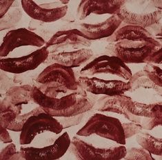 many different types of lips are arranged in a pattern on a sheet of paper that is red and white