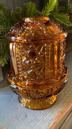 a glass jar sitting on top of a wooden table