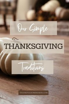 a white pumpkin sitting on top of a wooden table with the words our simple thanksgiving traditions