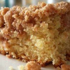 a close up of a piece of cake on a plate with some crumbs