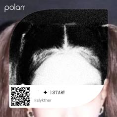 a woman with long hair has a qr scan on her face and is looking at the camera