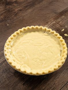 a pie crust sitting on top of a wooden table