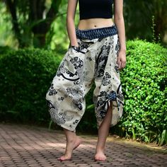 "White Koi Fishes Traditional Samurai pants, Wrap pants, Tie waist pants, Thai Fisherman pants, Kimono pants, Unisex Printed Cotton Samurai pants has one Pocket in front for storing item like Mobile phone, Wallet or Money. Cotton Baggy pants are great for any Occasion, Chillout, FreeStyle, Yoga, Traveling, Dancing, Going to Festivals, Working out, Martial arts, Etc... This item is made of high-quality cotton in the north of Thailand. Printed with Special technique and making with Craftsmanship f High Waist Harem Pants With Pockets For Beach, Beach High Waist Harem Pants With Pockets, Beach Harem Bottoms With Pockets, High Waist Harem Yoga Pants With Pockets, High Waist Harem Pants With Pockets For Yoga, Traditional Baggy Bottoms For Spring, Traditional Spring Trousers, Traditional Style Baggy Pants For Spring, Traditional Baggy Pants For Spring