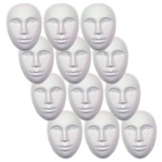 eight white plastic masks with faces on them