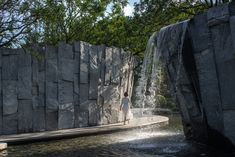 a person standing in front of a waterfall