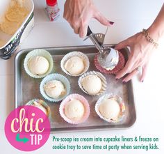 a person pouring icing onto cupcakes on a baking tray with other items nearby