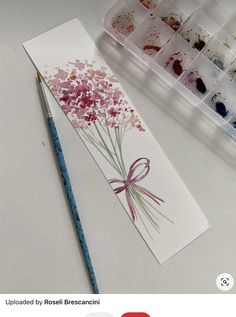 an art project with watercolor paints and flowers