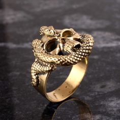 Brass Skull Head with Snake Ring, Gold Skull Ring, Men's Ring, Brass Snake Ring, Skull Ring, Gothic Ring, Serpent Ring, Halloween Gift Ring Size:- All Size Available In Variation Metal:-Brass ❥ Customers' satisfaction is our biggest priority, please contact us with any questions/queries for future or existing orders, and we will do our best to make sure you are happy with your order. ❥Please make sure to add the correct address during checkout. You can return your purchased item within 15 days a Skull And Snake Ring, Luxury Gold Skull Ring Gift, Gold Skull Ring, Mens Skull Rings Gold, Vintage Luxury Hallmarked Snake Ring, Snake Ring Gold, Serpent Ring, Gothic Ring, Gold Skull