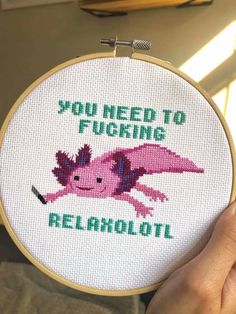 someone is holding up a cross - stitch project with the words you need to fugging relahol on it