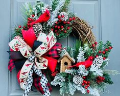 a christmas wreath hanging on the front door