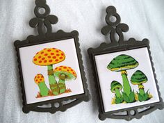 two framed pictures with colorful mushrooms on them