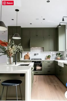 a kitchen with green cabinets and white counter tops is featured in this ad for save