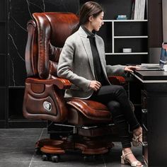 a woman is sitting in an office chair