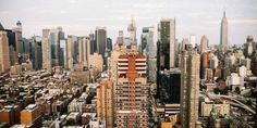 an aerial view of new york city with skyscrapers