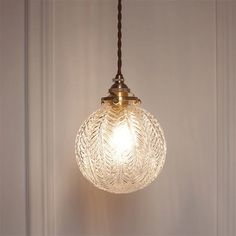 a light hanging from a ceiling in a room