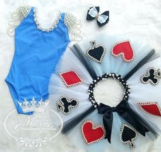 a blue bodysuit with red and black hearts is next to a tutu skirt