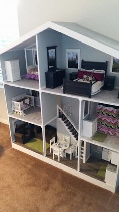 a doll house with furniture and accessories in it