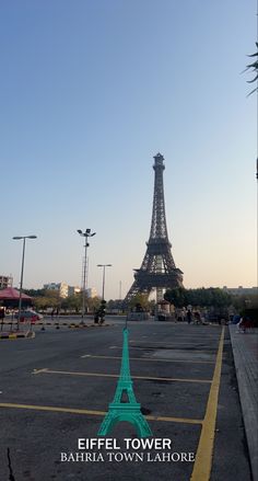 the eiffel tower in paris, france is seen from across the parking lot