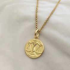 "This beautiful Libra Coin Pendant Necklace is the perfect way to show your love and appreciation to a special someone. Crafted from solid sterling silver or plated with gold vermeil, this necklace features a detailed hand carved Libra Zodiac sign symbol with scales of justice representing the perfect balance. It makes a great birthday or graduation gift for any Libra in your life. Collect all 12 zodiac signs form our one of a kind hand carved collection in solid silver or gold or set up with bi Libra Zodiac Sign Symbol, Libra Accessories, Gold Necklace Libra, Luxury Gold Plated Zodiac Sign Necklace, Luxury Gold Zodiac Sign Necklace, Libra Jewelry, Libra Charm, Zodiac Signs Symbols, Libra Pendant