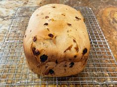 a loaf of bread sitting on top of a cooling rack