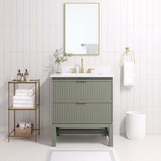 a bathroom with a sink, mirror and towel rack