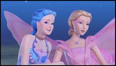 two barbie dolls are dressed in pink and blue