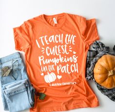 "What a great personalized Halloween and fall shirt for teachers! Features the saying, \"I teach the cutest pumpkins in the patch\" and can be personalized with school name and grade or teacher name and grade. Makes an adorable shirt for fall events at school. Available in heather clay, heather orange or your choice of a custom color. Our shirts are unisex sizes and are soft and comfortable. They run true to size, however some ladies prefer a slimmer fit and choose to go a size down. Please be s Fall Tshirts, Coffee Fall, Oktoberfest Shirt, Fall Tshirt, Spice Coffee, Witch Pumpkin, Pumpkin Patch Outfit, Fall Shirts Women, Teaching Shirts