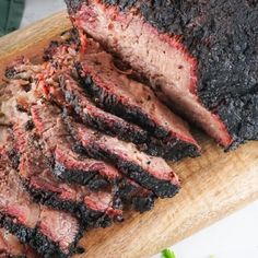 the meat is sliced up and ready to be served on the grilling board for consumption