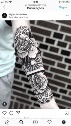 a woman's arm with black and white flowers on it